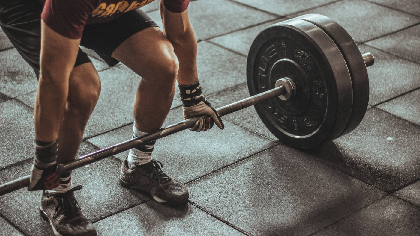 A man lifting weights during a workout.