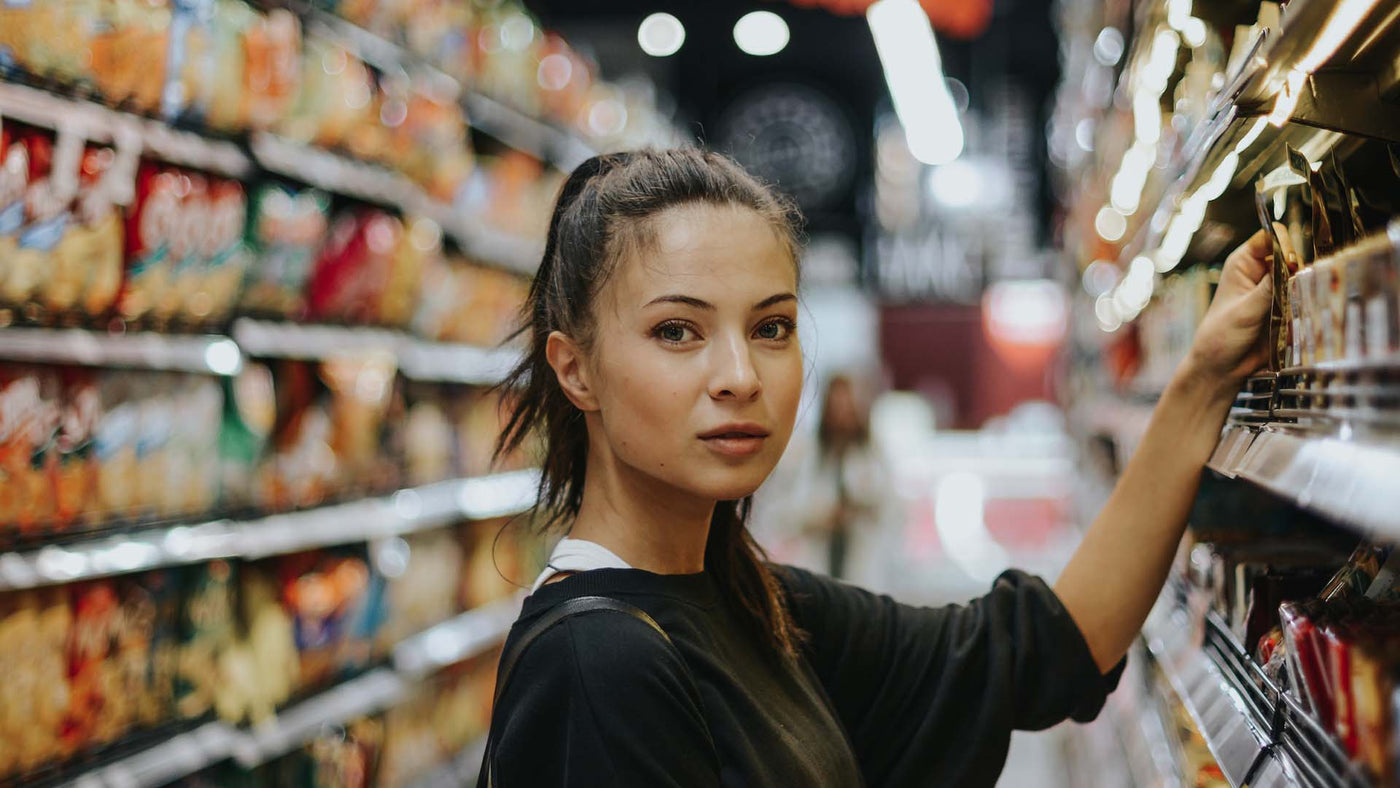 woman picking a product in a store